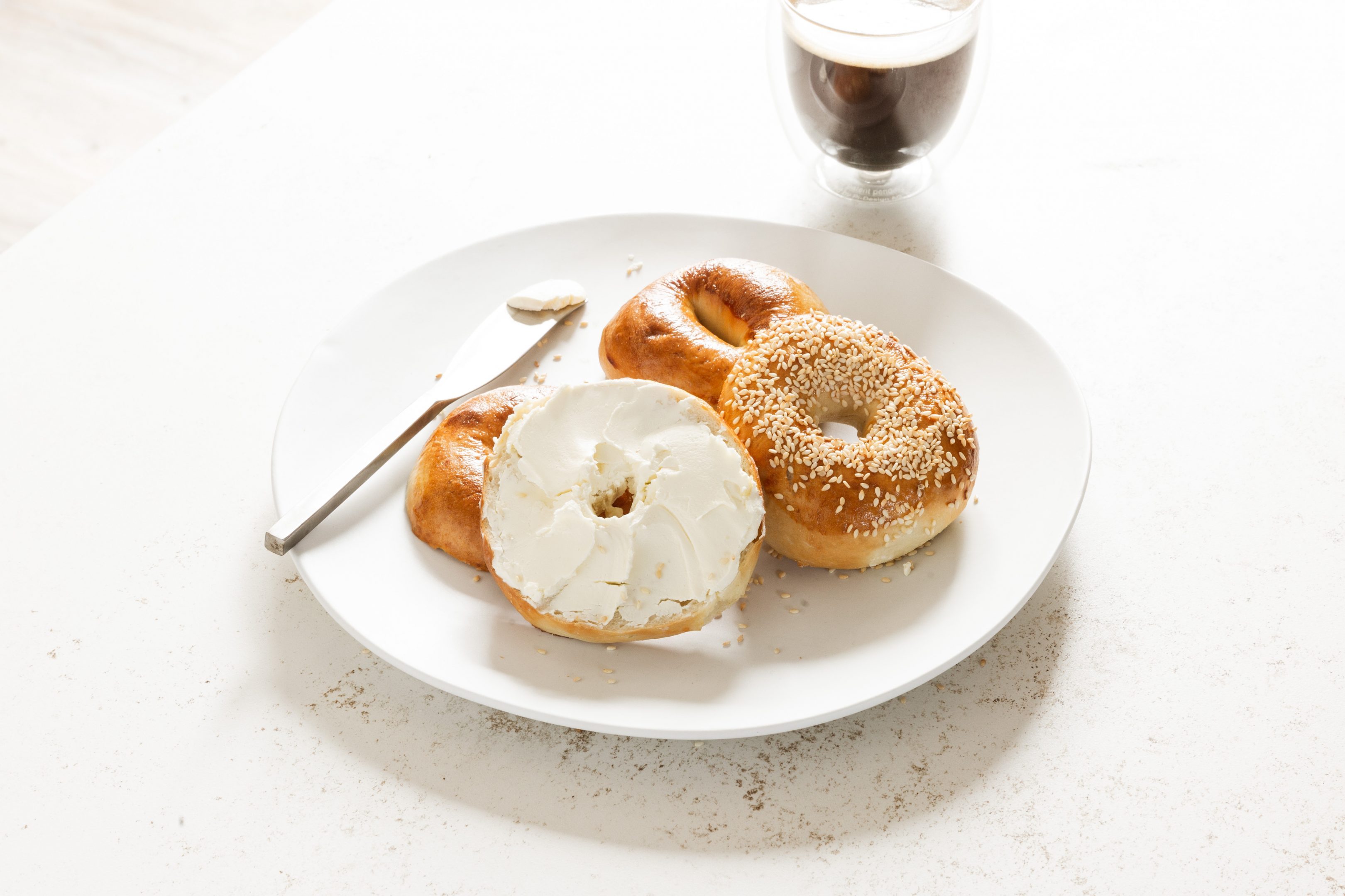 fresh steam cooked bagel with cream cheese spread